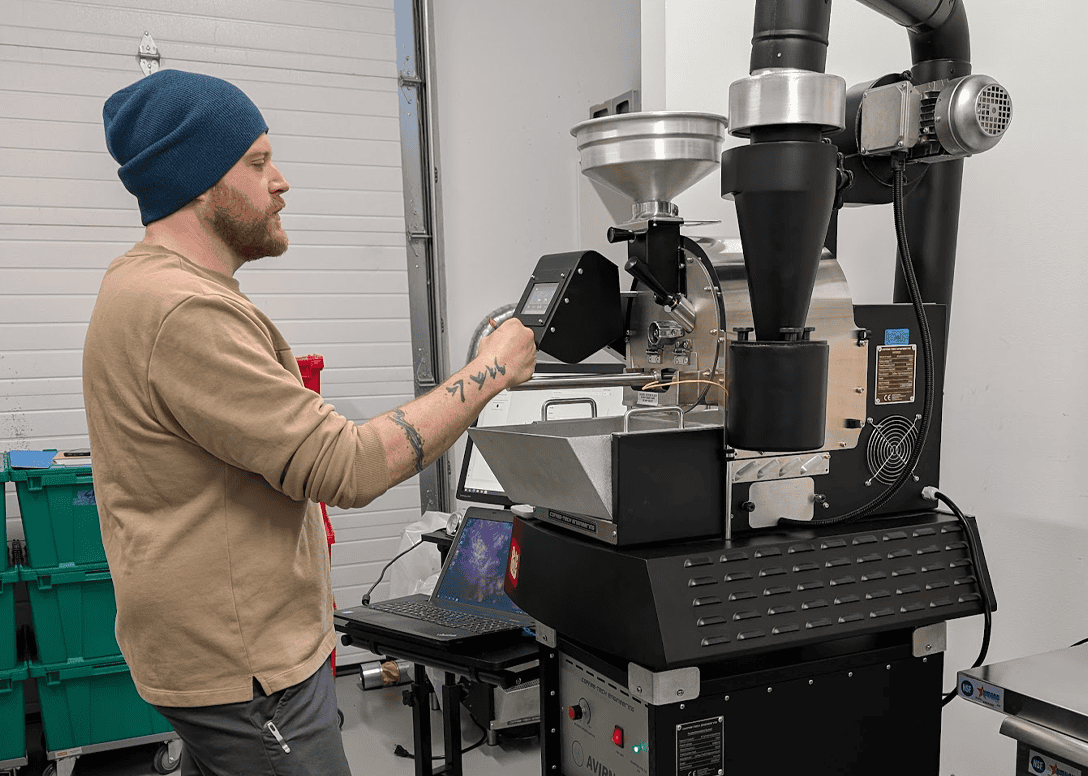 James roasting test batches of coffee at the roastery at Red Bird Roasting Kelowna